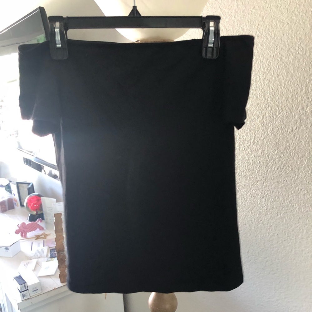 Black off the shoulder tee.